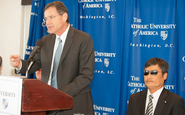 Stephen Schneck, director of Catholic University's Institute for Policy Research and Catholic Studies, introduces Chen Guangcheng as a new visiting fellow of the institute.