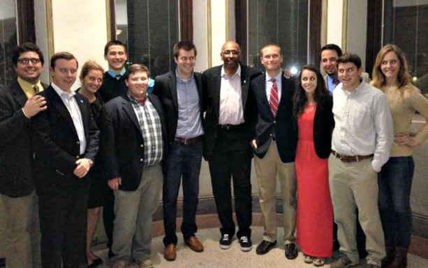 Catholic University students take a picture with Michael Steele, commentator for MSNBC and former Republican National Committee Chairman.