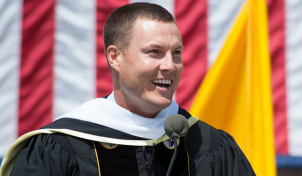 Philip Rivers, quarterback for the San Diego Chargers, addresses graduates during the 125th Annual Commencement Ceremony at CUA on May 17, 2014.